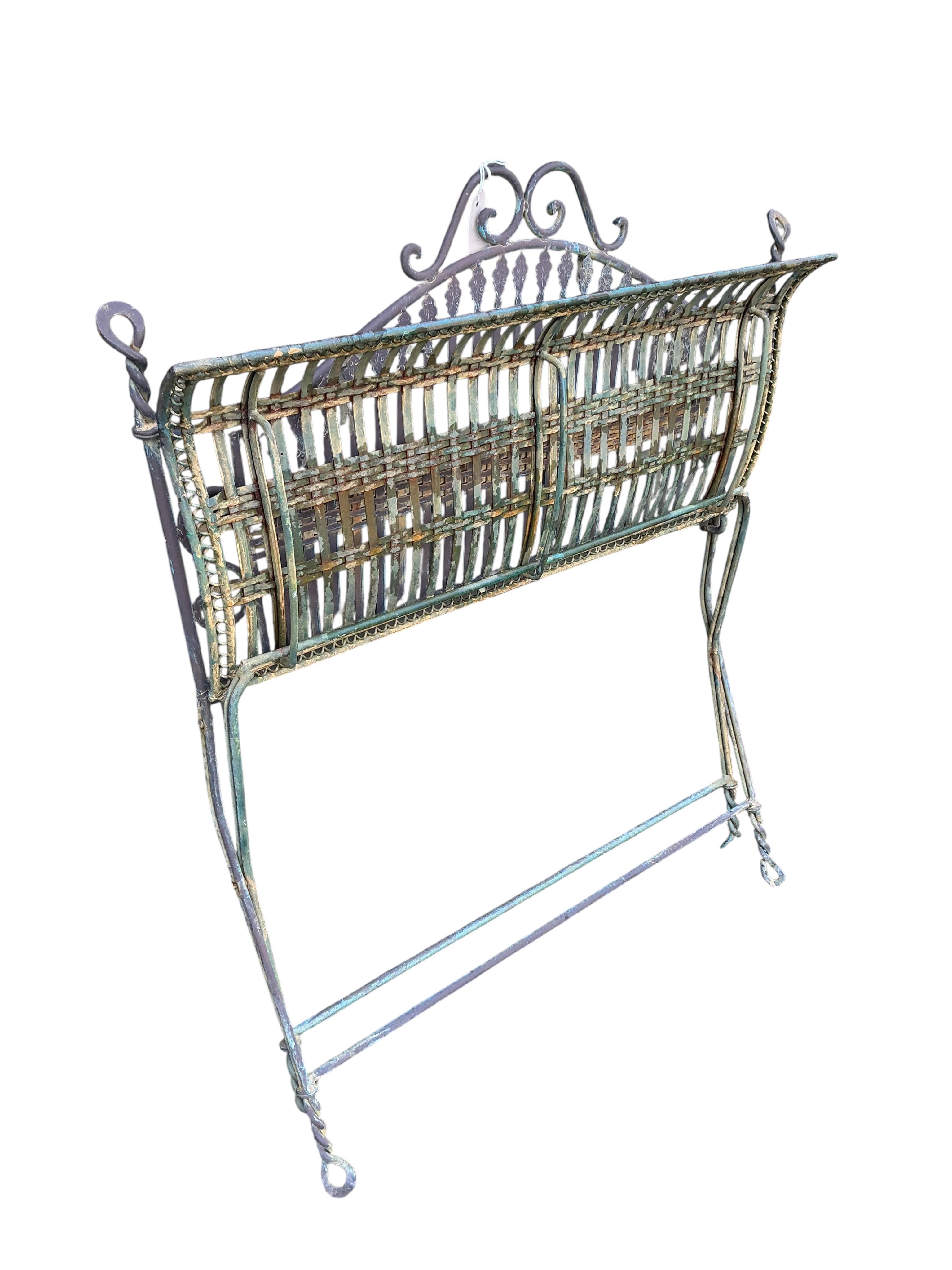 A wrought iron folding garden bench, width 99cm, depth 52cm, height 92cm